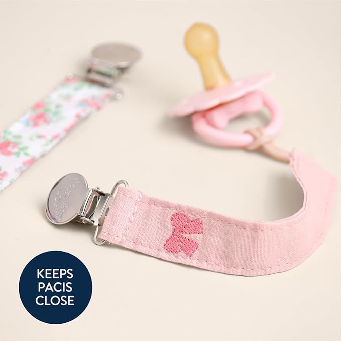 Itzy Ritzy Fabric Pacifier Strap – Universal Pacifier Clip Attaches to Clothing, Strollers & Bags - Keeps Pacifiers, Teethers & Toys Secure & Within Reach - Pack of 2 (Bows & Floral)