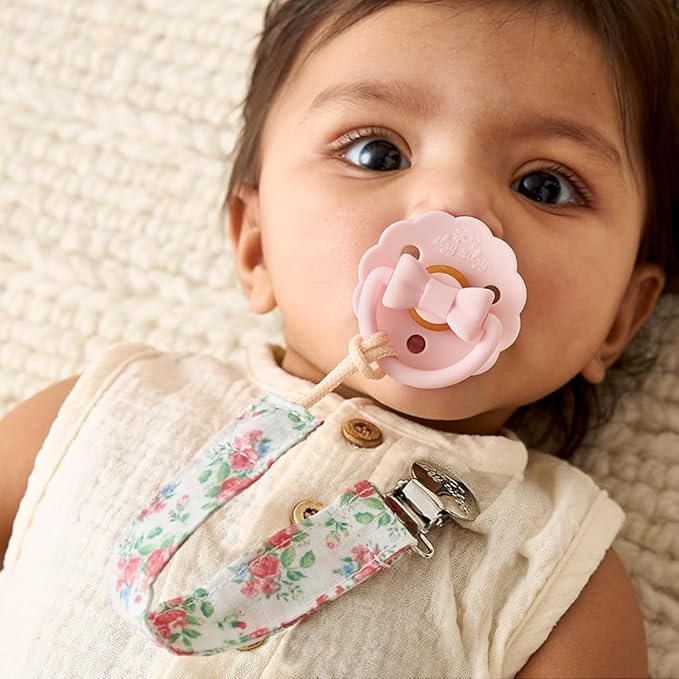 Itzy Ritzy Fabric Pacifier Strap – Universal Pacifier Clip Attaches to Clothing, Strollers & Bags - Keeps Pacifiers, Teethers & Toys Secure & Within Reach - Pack of 2 (Bows & Floral)