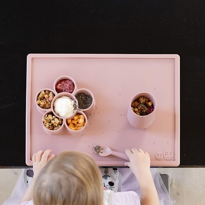 ezpz Play Mat for Baby + Toddler - 6 Months+ (Blush) - Suction Plate with Flower Compartments for Crafts, Painting, Sorting, Snack Time - Fits Standard Piece of Paper