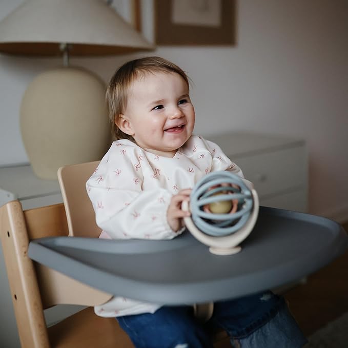 mushie Long Sleeve Baby Bib | Water Resistant Adjustable Fit for Ages 6-24 Months