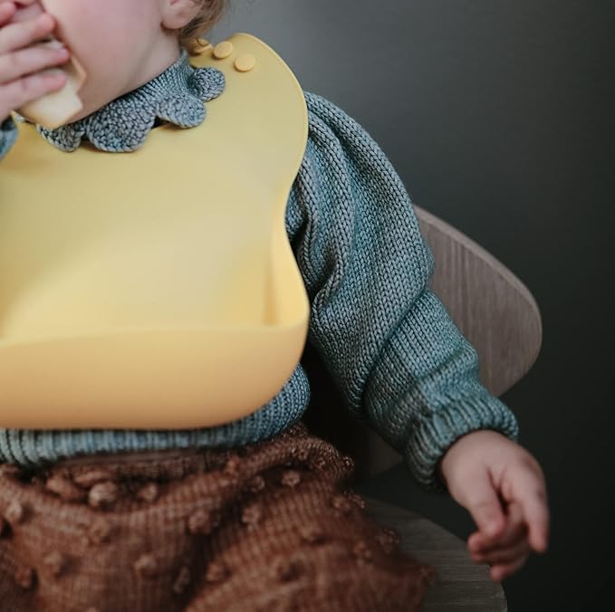 mushie Silicone Baby Bib | Adjustable Fit Waterproof Bibs (Sunshine)