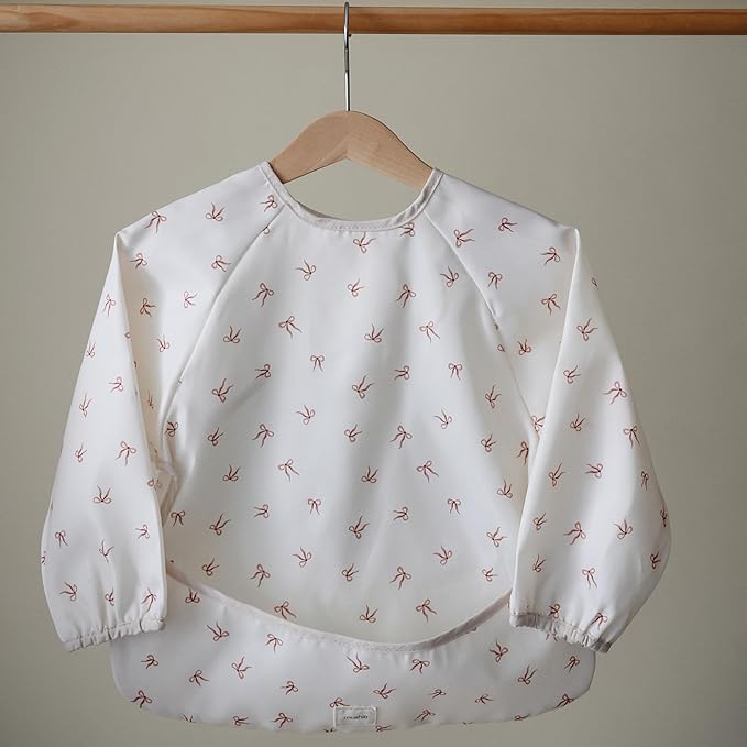 mushie Long Sleeve Baby Bib | Water Resistant Adjustable Fit for Ages 6-24 Months
